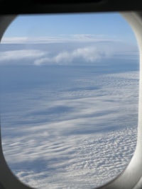 a view of clouds from an airplane window